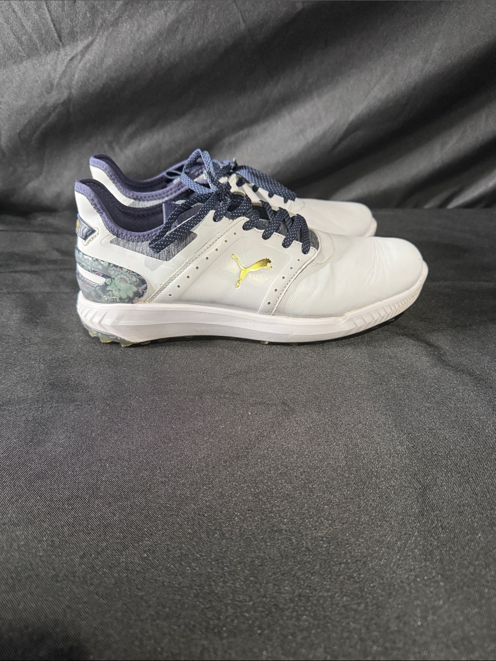 Puma men’s  White and Navy Athletic Golf Shoes with Gold Logo